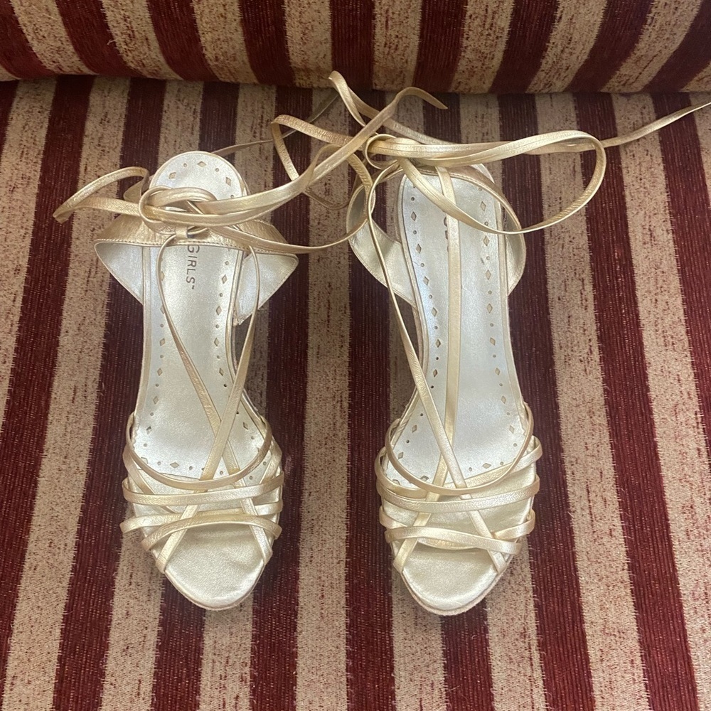 NWOT BCBGirls gold, wedge heel with tie up the leg as low or high as you want.